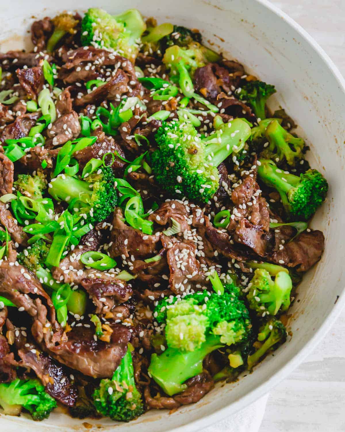 Beef shaved steak stir fry with broccoli, stir fry sauce and sesame seeds.