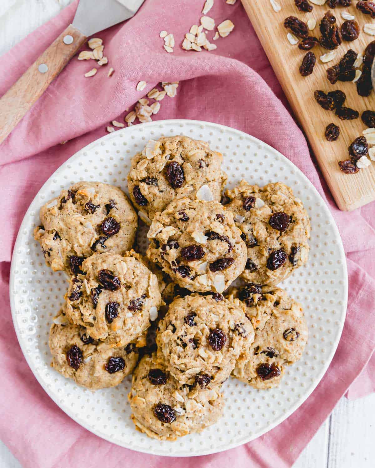 Chewy soft vegan oatmeal raisin cookie recipe on a white plate.