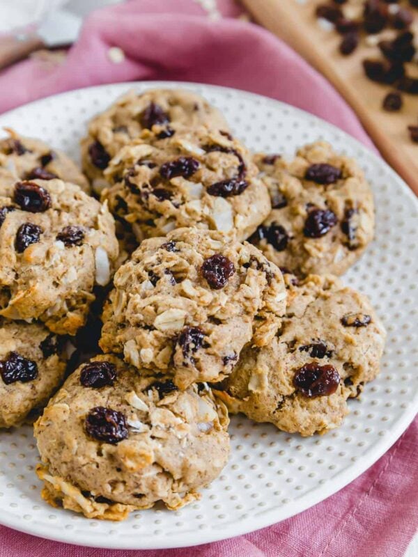 Vegan oatmeal raisin cookies on a plate.