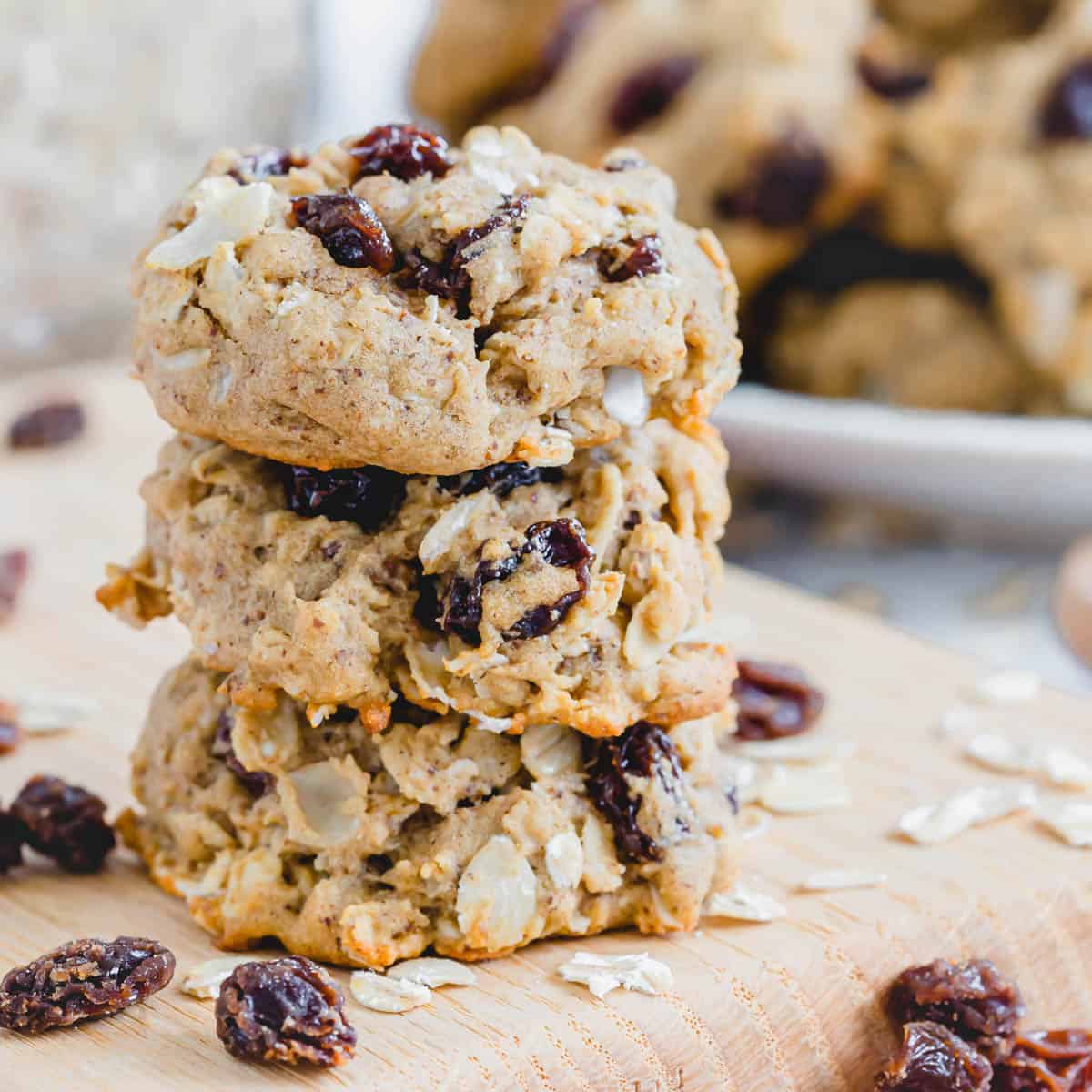 Stack of three oatmeal raisin vegan cookies.