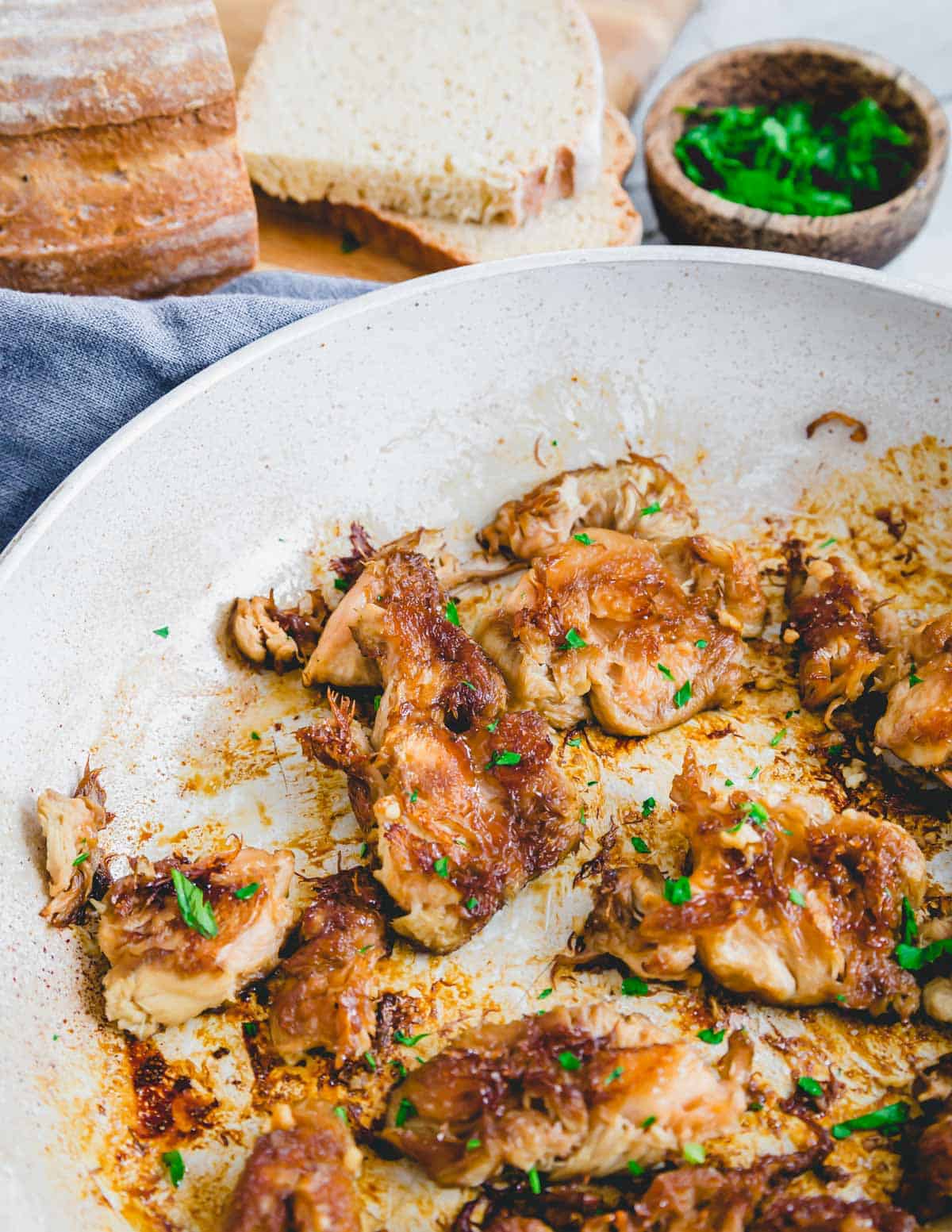 Caramelized lion's mane mushrooms with tamari, garlic and butter in a white skillet.