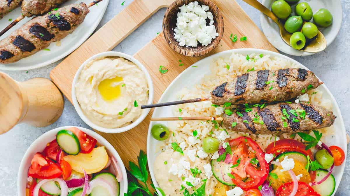 Beef Kafta on a plate with veggies.