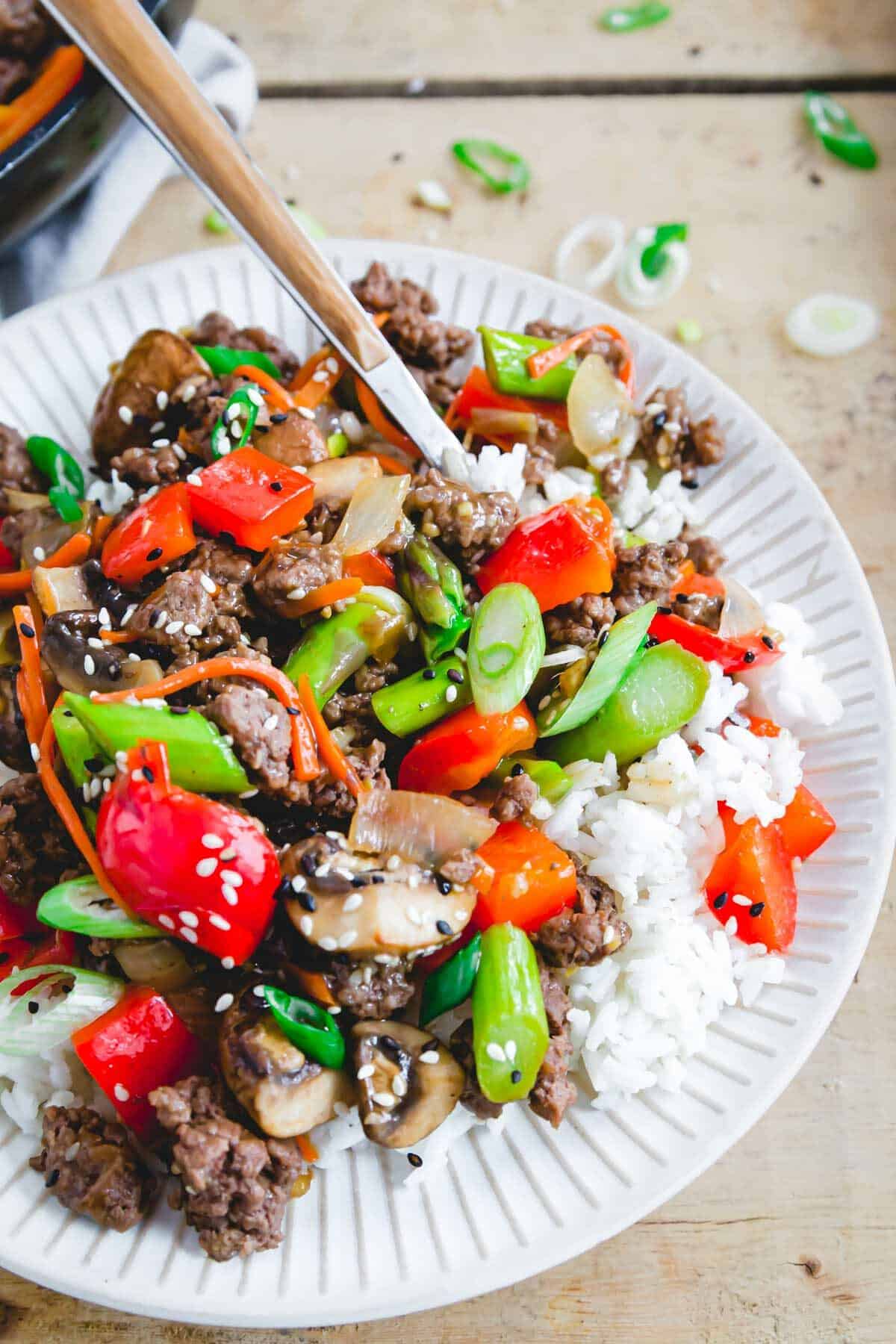 Asian inspired ground beef stir fry recipe served with white rice.