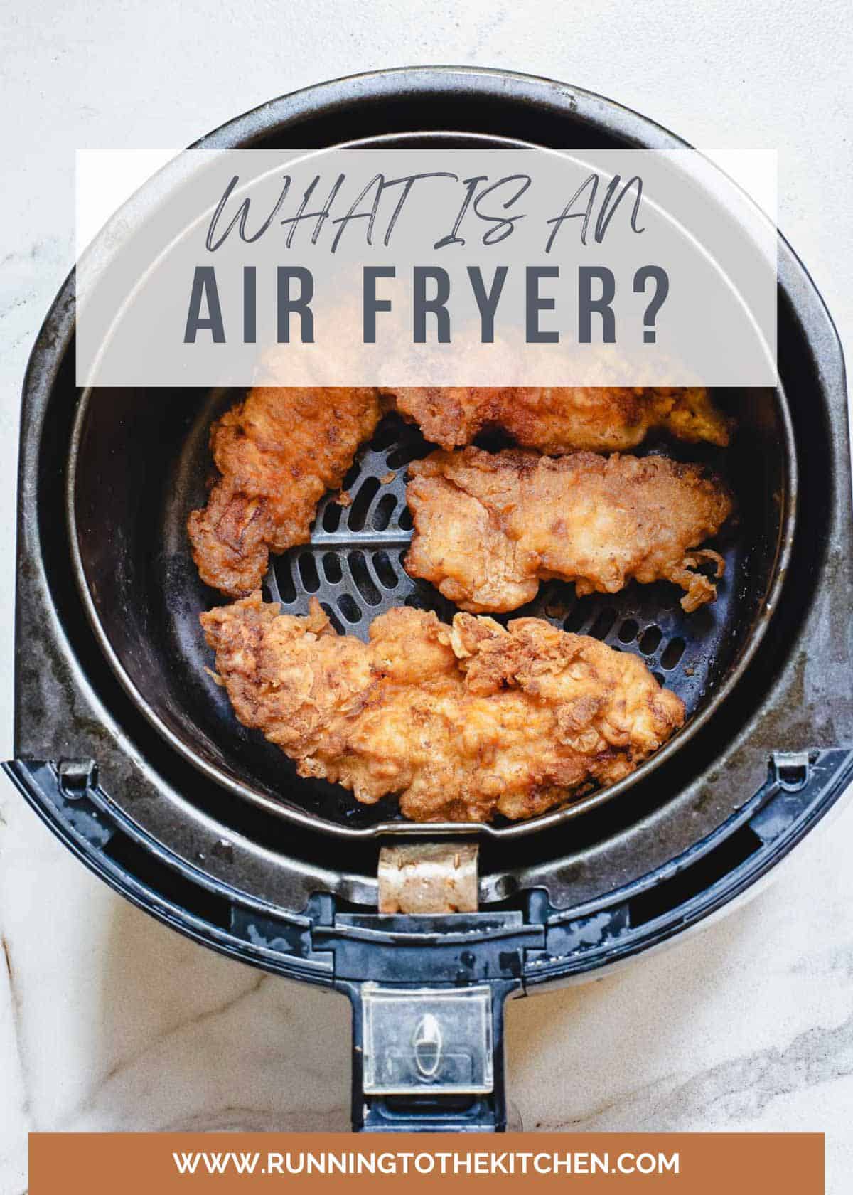Air fryer with buffalo chicken tenders in the basket.