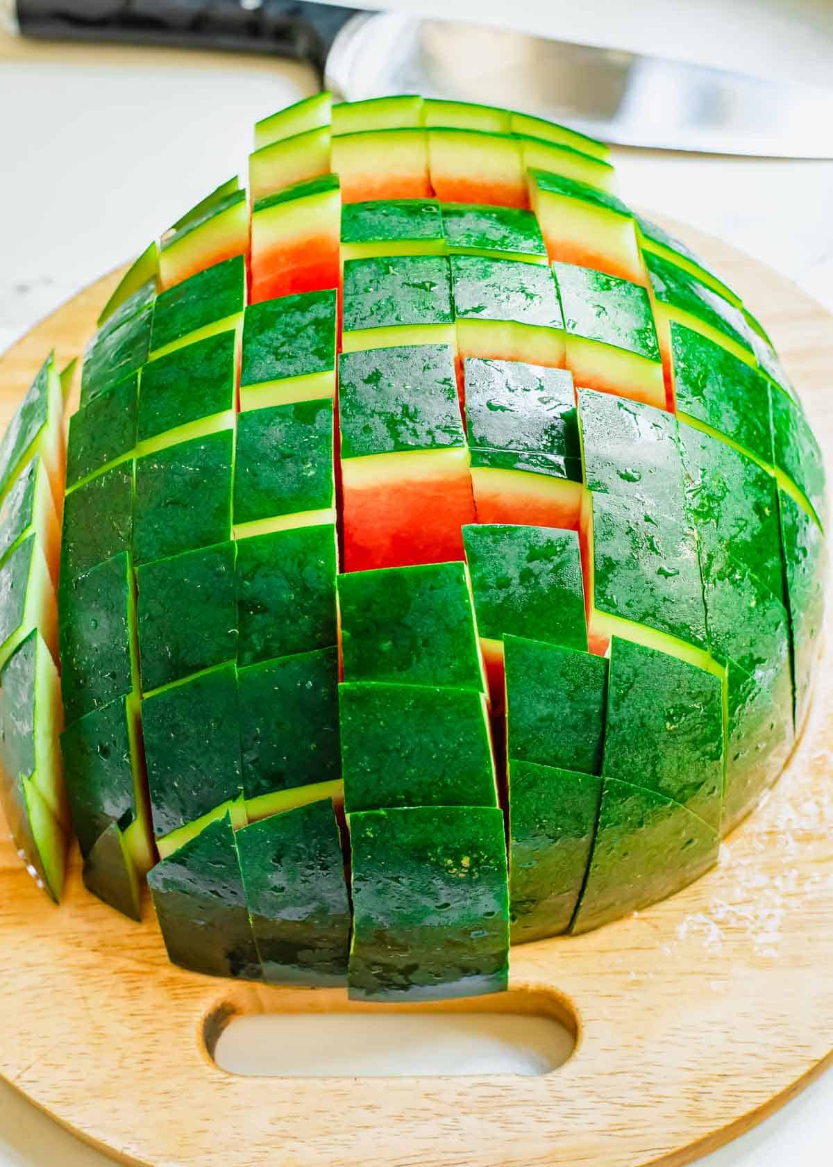 Watermelon half cut into sticks.