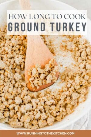 Seasoned ground turkey in a skillet with spatula.