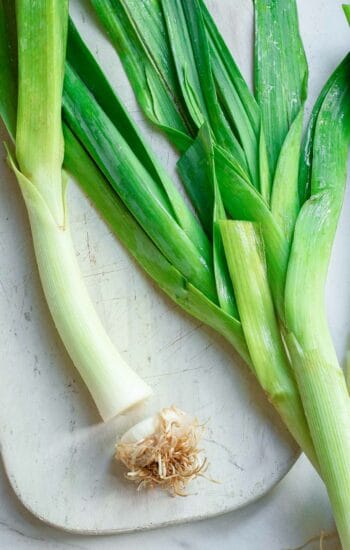 Leeks with the bottom root cut off.