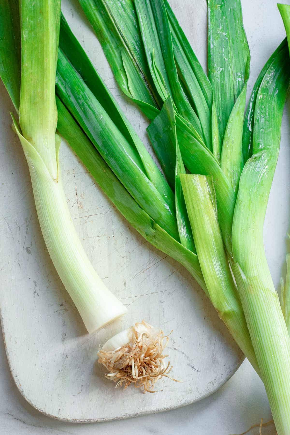 Leeks with the bottom root cut off.
