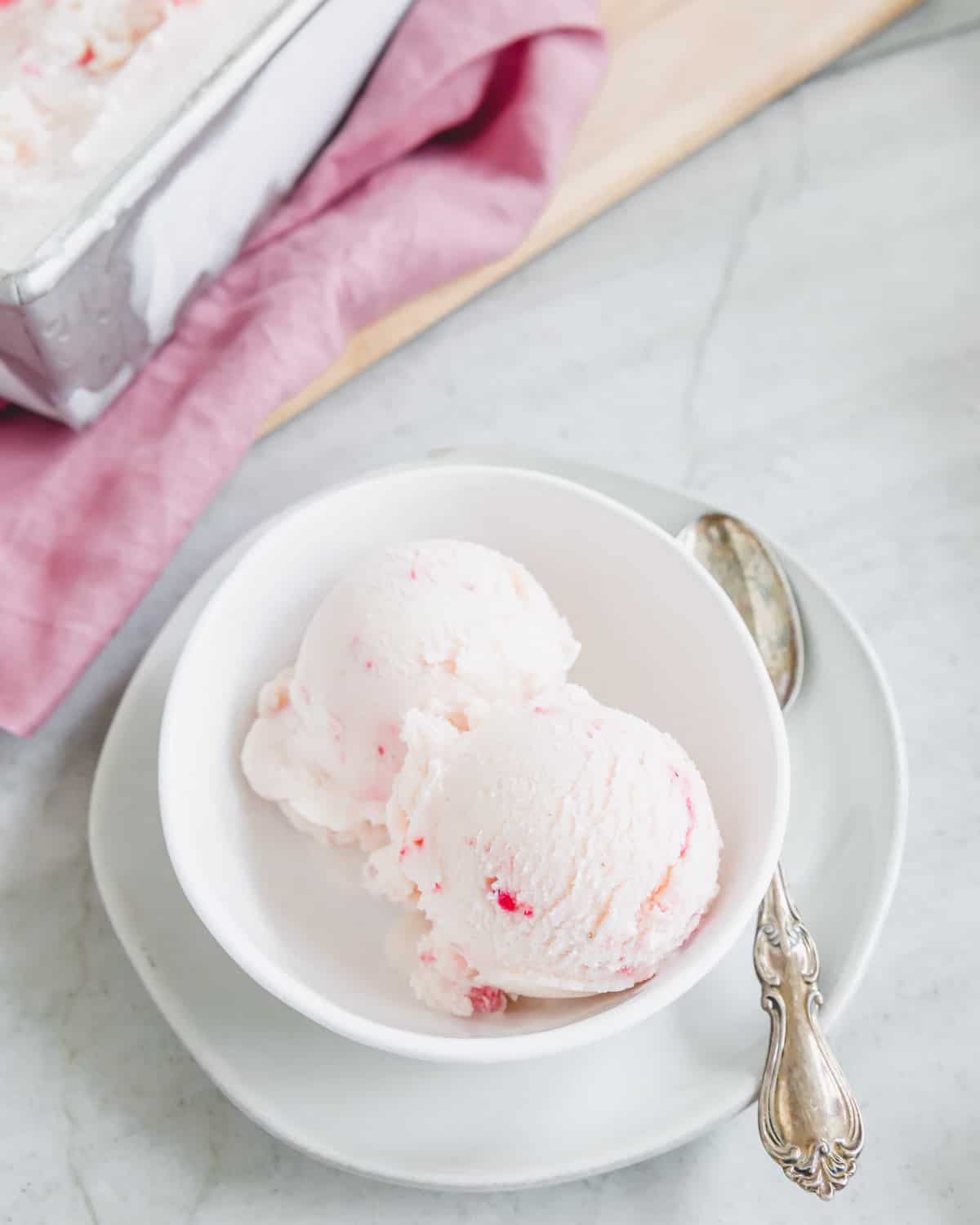Two scoops of strawberry kefir ice cream.