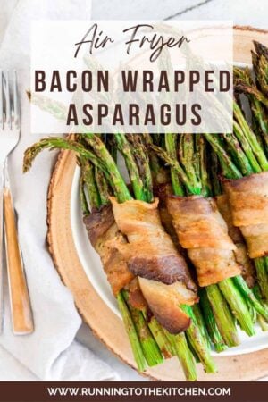 Bacon wrapped asparagus bundles cooked in the air fryer on a plate.