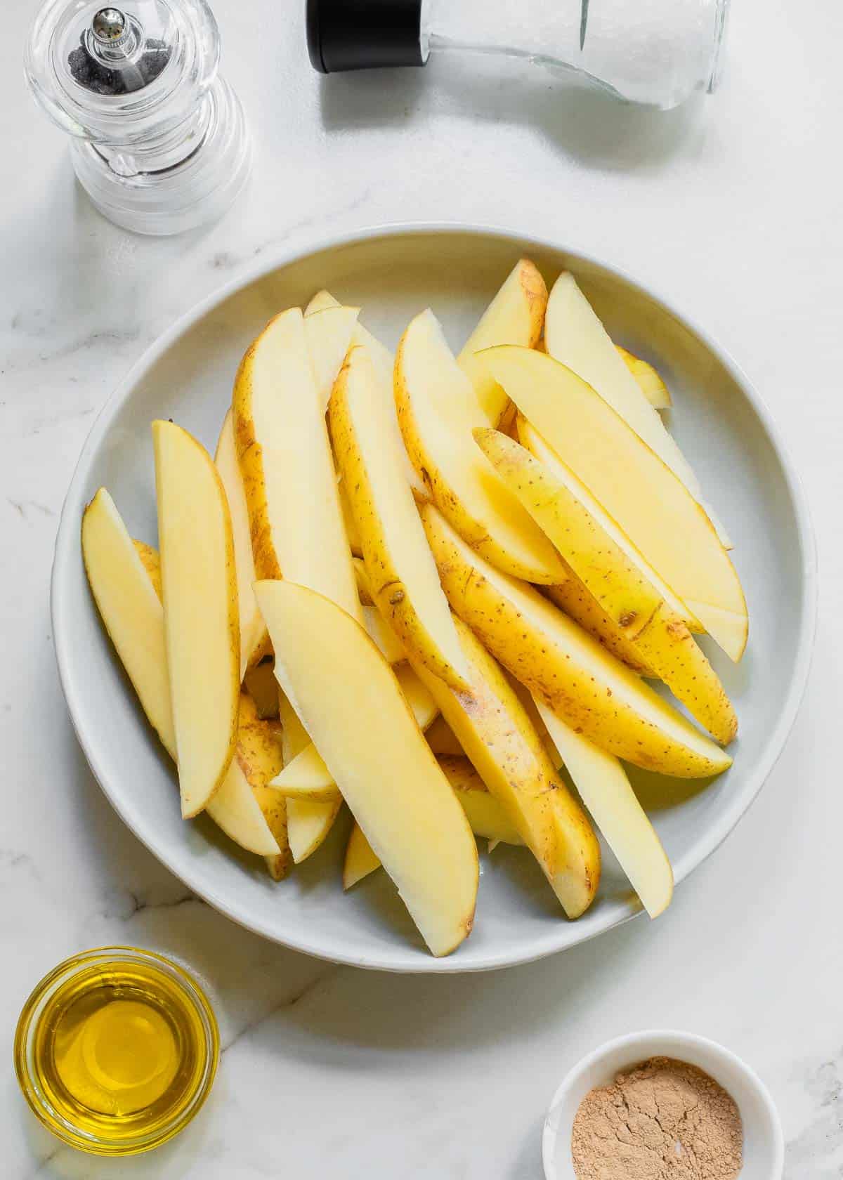 Potato wedge slices on a plate.