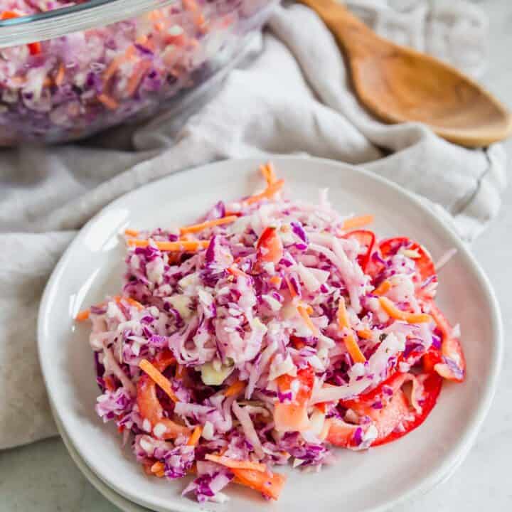 Coleslaw recipe on two stacked plates.