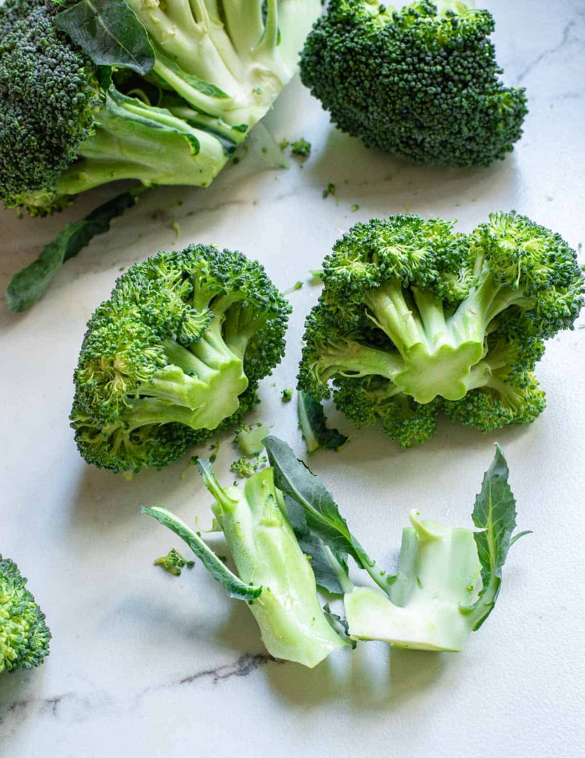 Cutting broccoli stems from the florets.