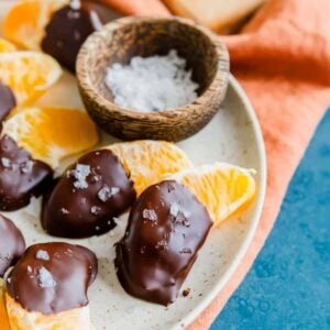 Chocolate oranges with sea salt on a plate.