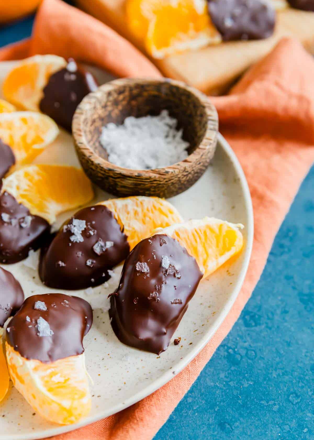 Chocolate oranges with sea salt on a plate.