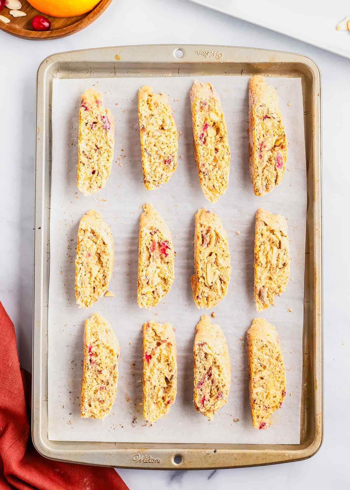 Cranberry almond biscotti cut into slices after the first bake.