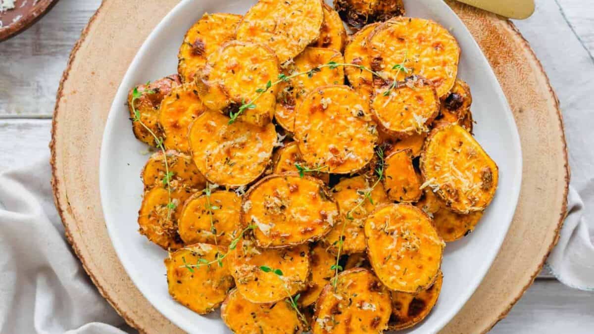 Roasted sweet potatoes on a white plate.