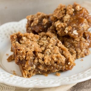 Oatmeal bars on a white plate.