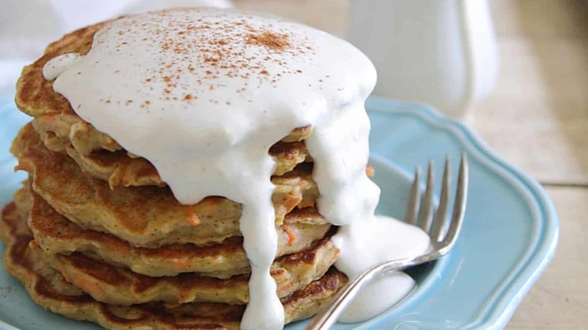 Apple carrot cake pancake stack with maple cream cheese sauce.