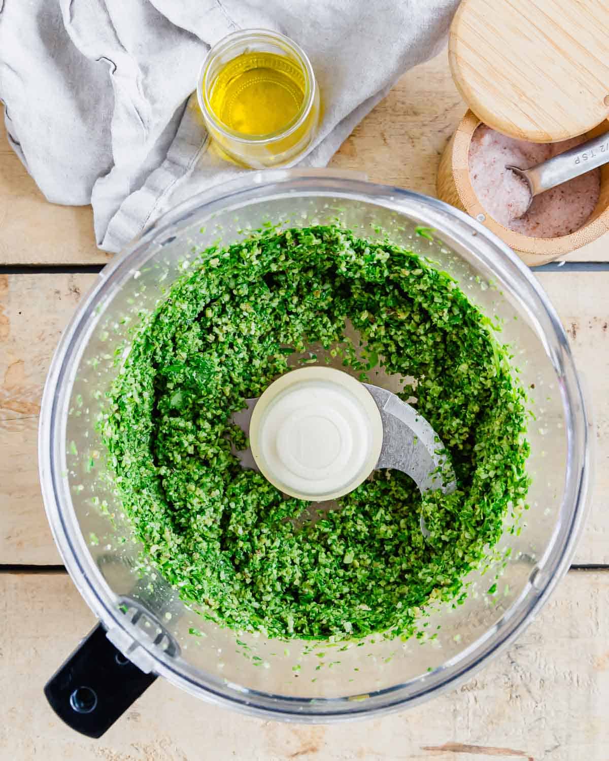 Arugula pesto in a food processor.