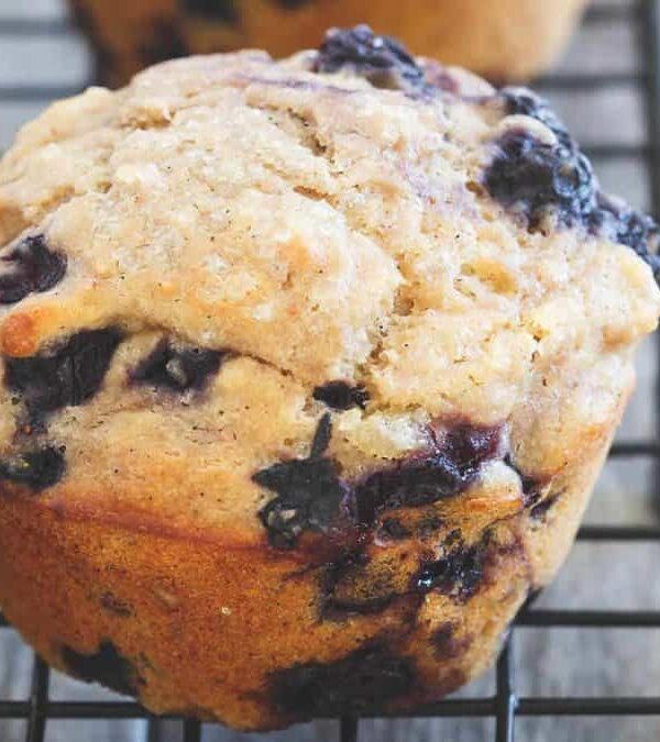 Blueberry muffins on a cooling rack.