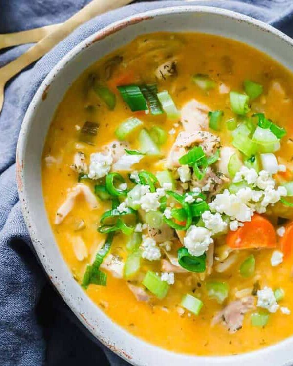 Two bowls of buffalo chicken soup on a table.