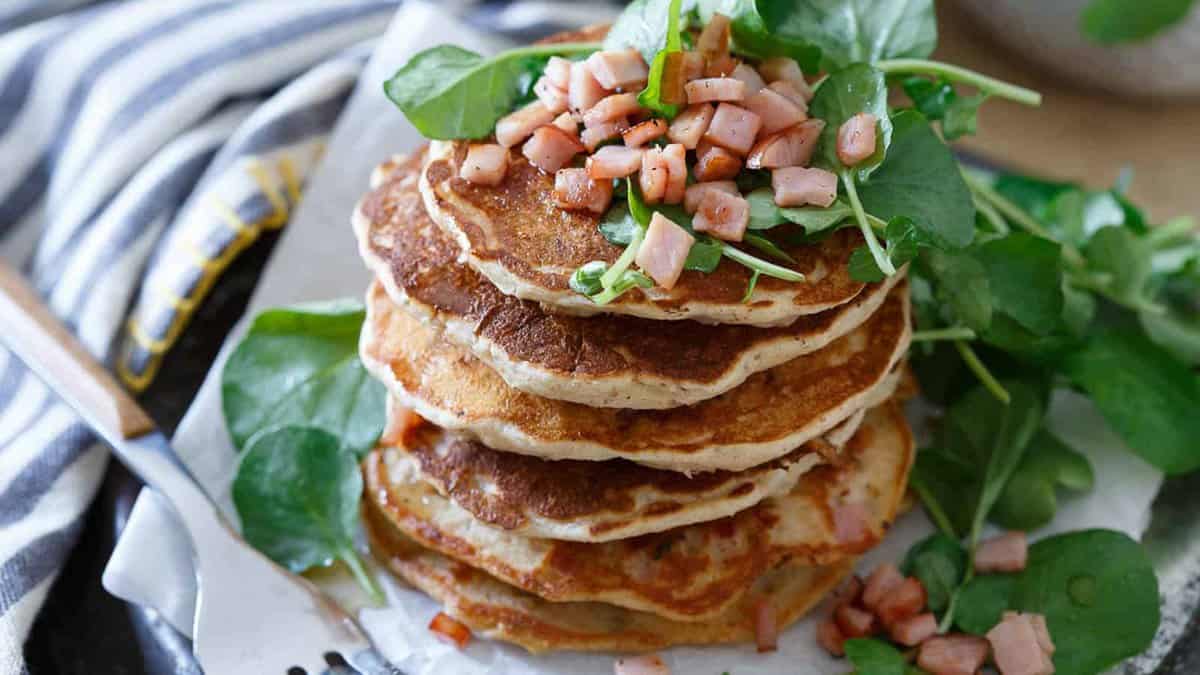 Pancakes with chopped Canadian bacon and baby greens.