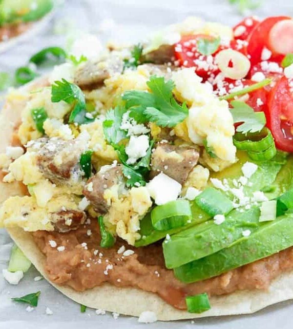 Mexican breakfast tostadas on a baking sheet.