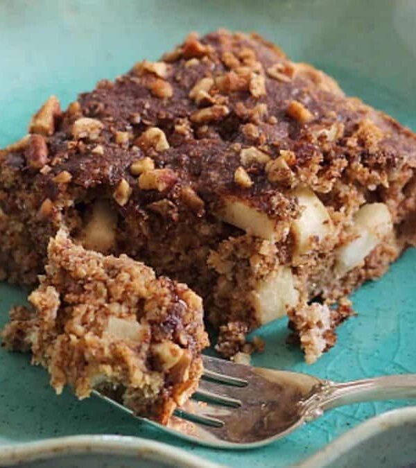 A piece of cake on a plate with a fork.
