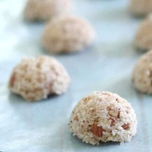 Coconut rice balls on a baking sheet.