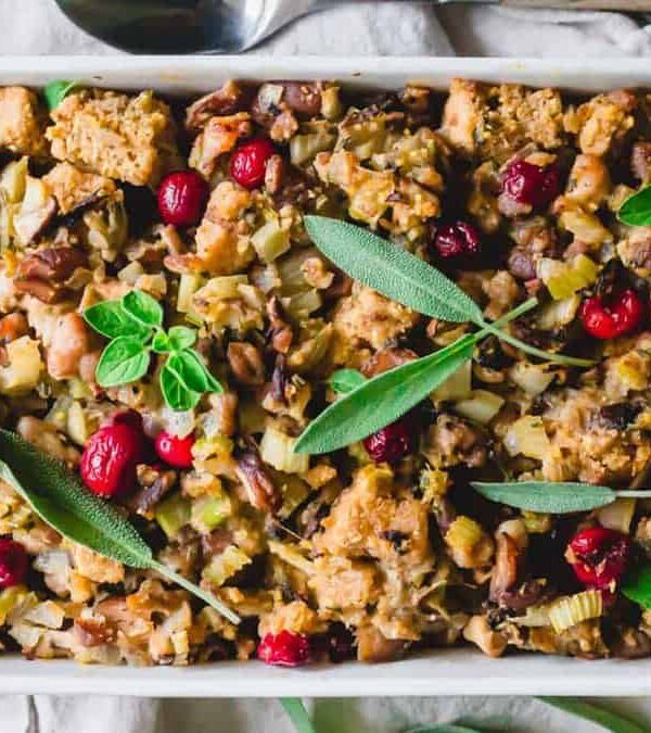 A dish of stuffing with cranberries and sage.