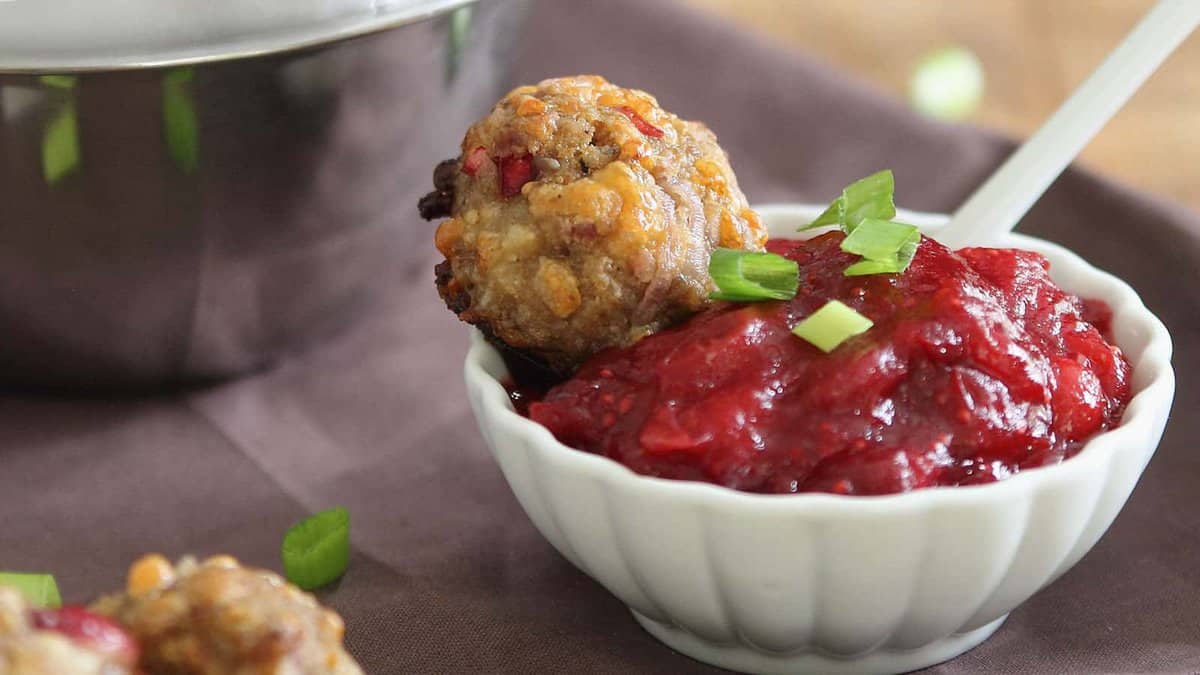 Cranberry sausage cheddar balls with cranberry dipping sauce.