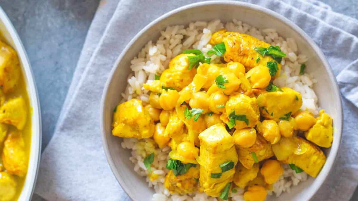 Turmeric chicken with chickpeas over rice.
