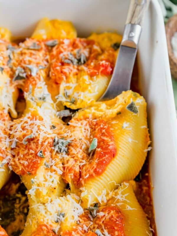 Close up of a pumpkin ricotta and sage stuffed shell.