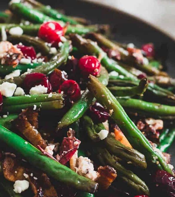 Green beans and cranberries on a plate.