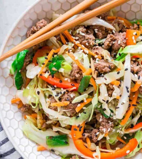 A bowl of beef and cabbage stir fry.