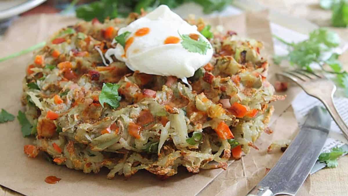 Hashbrown waffles with a poached egg on top.