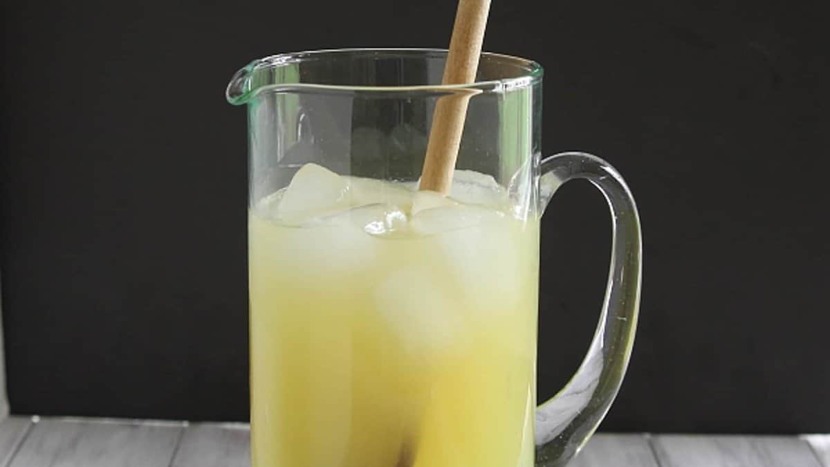 A homemade sports drink with citrus flavors and natural electrolytes in a glass.