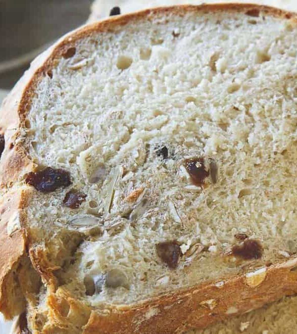 A loaf of bread with raisins and nuts.