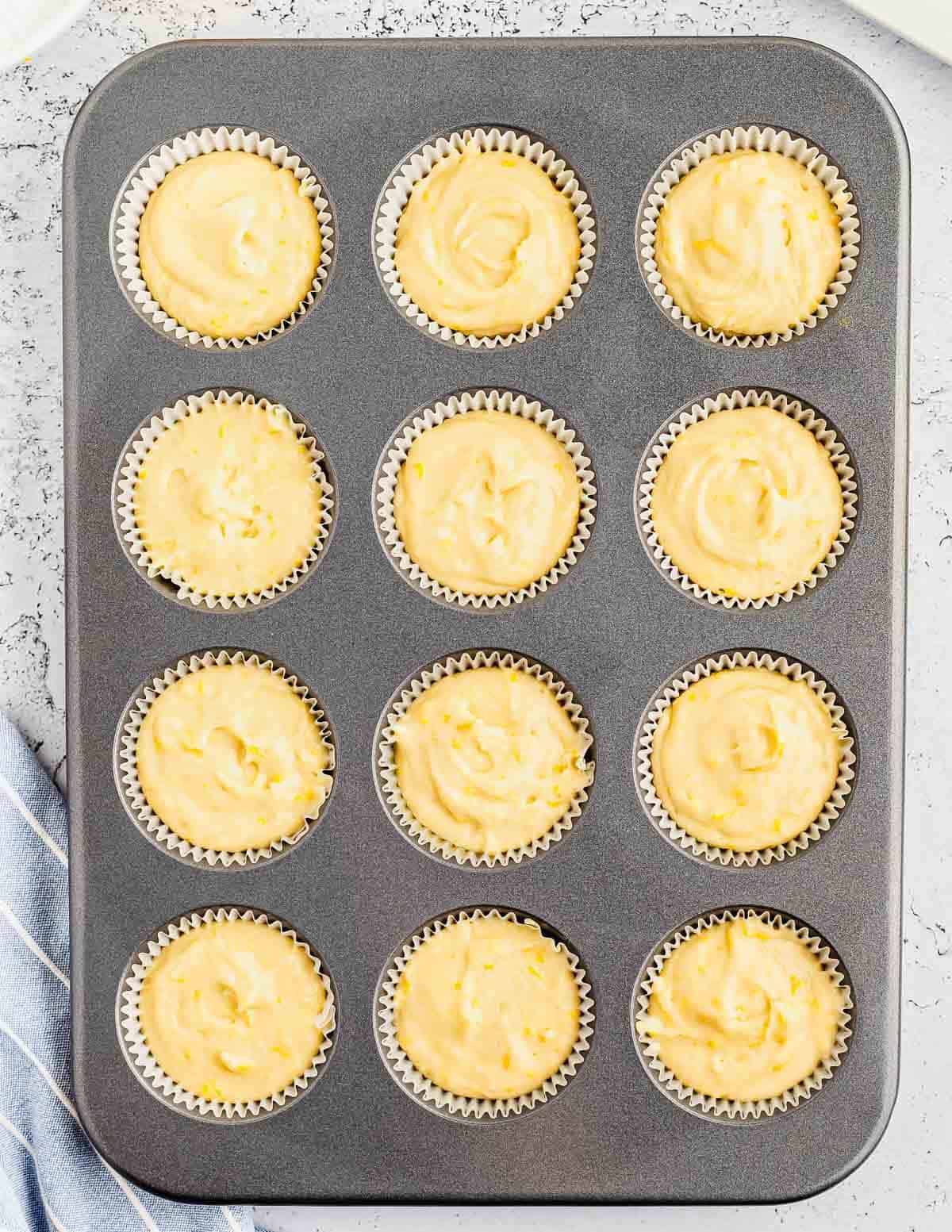 A muffin tin filled with batter.