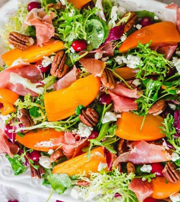 A salad with pomegranate, walnuts and cranberries.