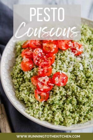 Pesto couscous in a bowl with tomatoes.