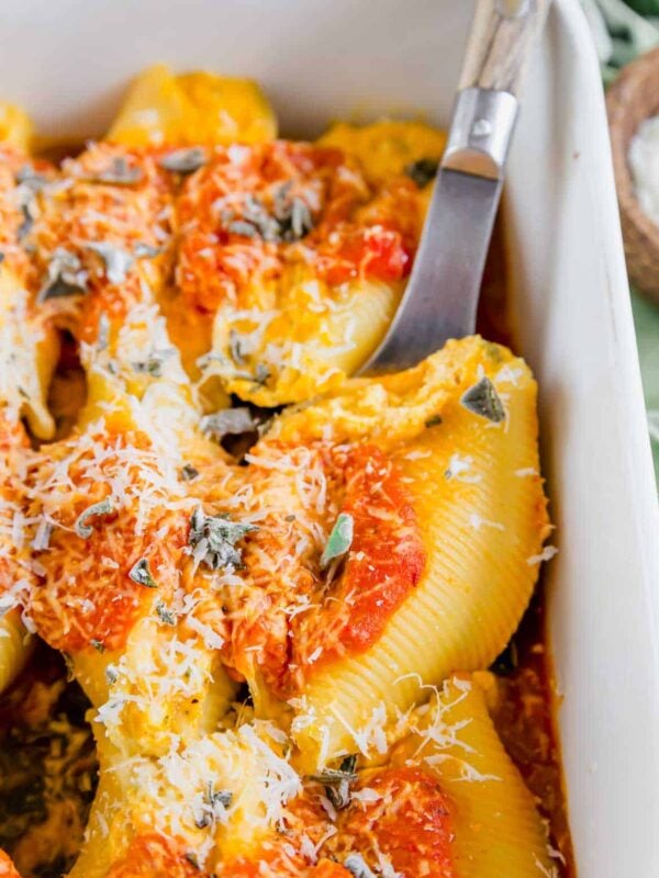 Close up of a pumpkin ricotta and sage stuffed shell.