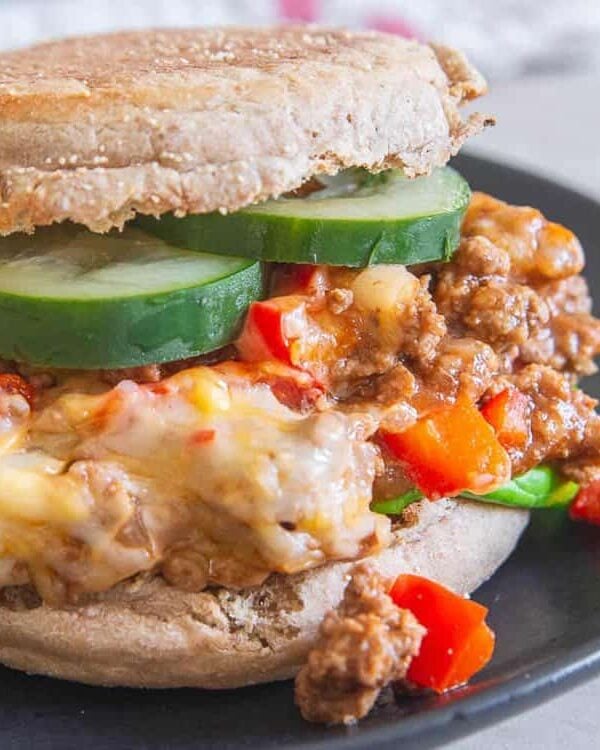 Sloppy Joes on an English muffin on a plate.