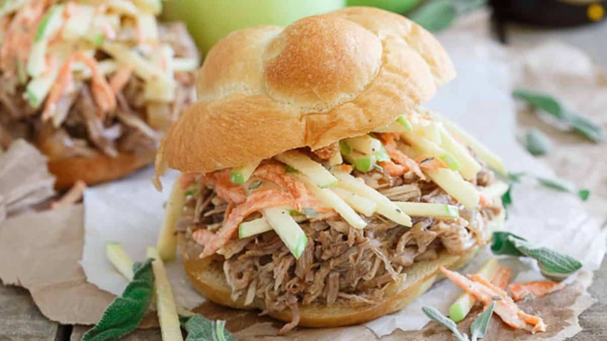 Slow cooker apple BBQ pulled pork sandwiches with apple carrot raisin slaw.