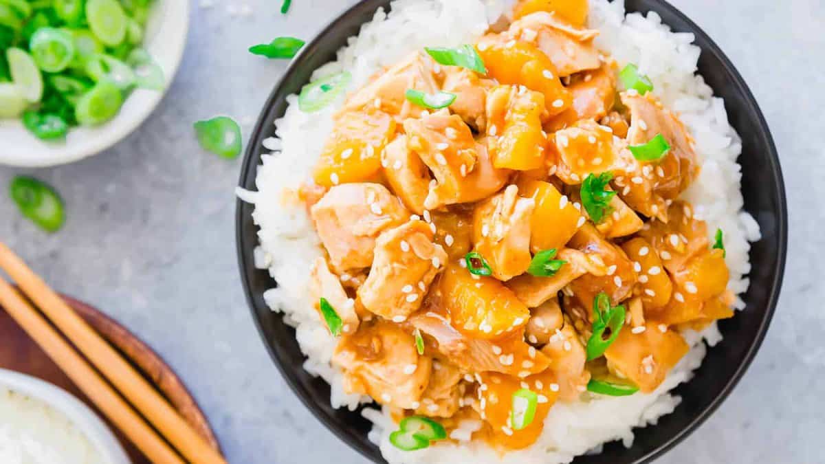 Honey garlic chicken in a bowl served over rice.