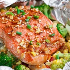 Salmon and broccoli wrapped in foil.