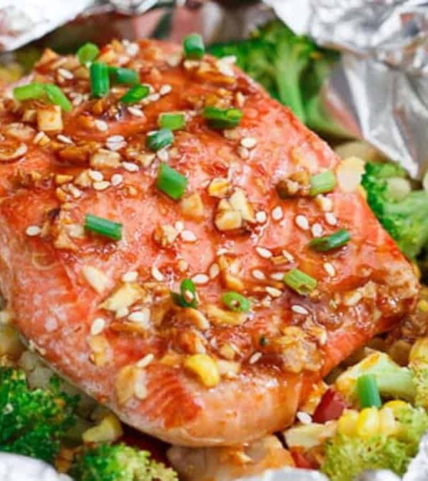 Salmon and broccoli wrapped in foil.