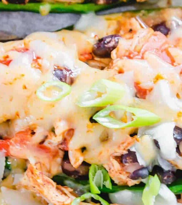 Mexican stuffed poblano peppers on a baking sheet.