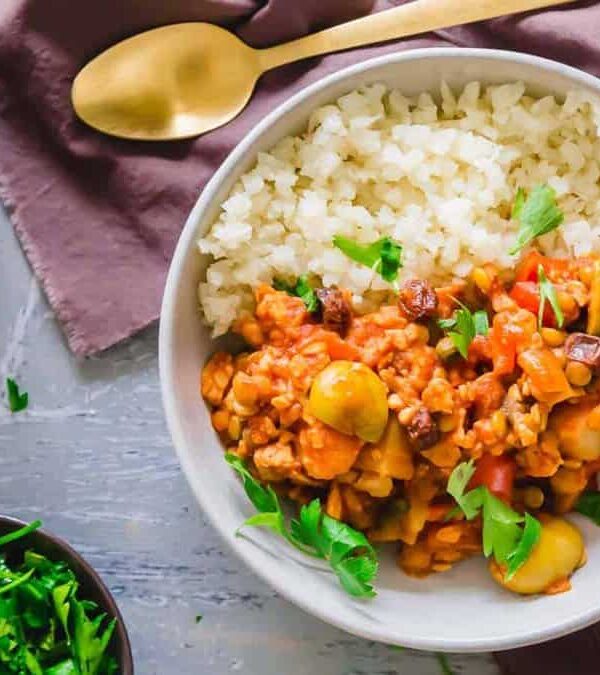 Two bowls of picadillo on a table.